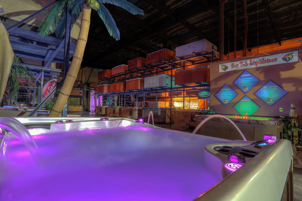 Hot Tub with purple lit water in warehouse
