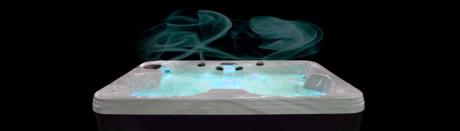 Coast Spas Patio Hot Tub at night with glowing lights